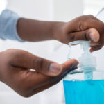 Close Up Of Boy Washing Hands With Soap At Home To Prevent Infection